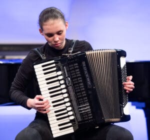 11/43 Student playing on accordion