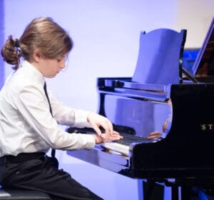 41/43 Student performing on piano